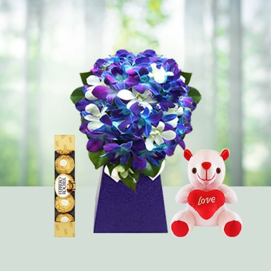 Send Orchid Flowers with chocolates and teddy combo